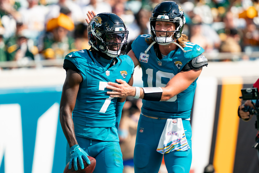 JACKSONVILLE, FL - OCTOBER 27: Jacksonville Jaguars quarterback Trevor Lawrence (16) and Jacksonville Jaguars wide receiver Brian Thomas Jr. (7) celebrate after a touchdown during a NFL football game between the Green Bay Packers and the Jacksonville Jaguars on October 27th, 2024 at EverBank Stadium in Jacksonville, FL. (Photo by Chris Leduc/Icon Sportswire)