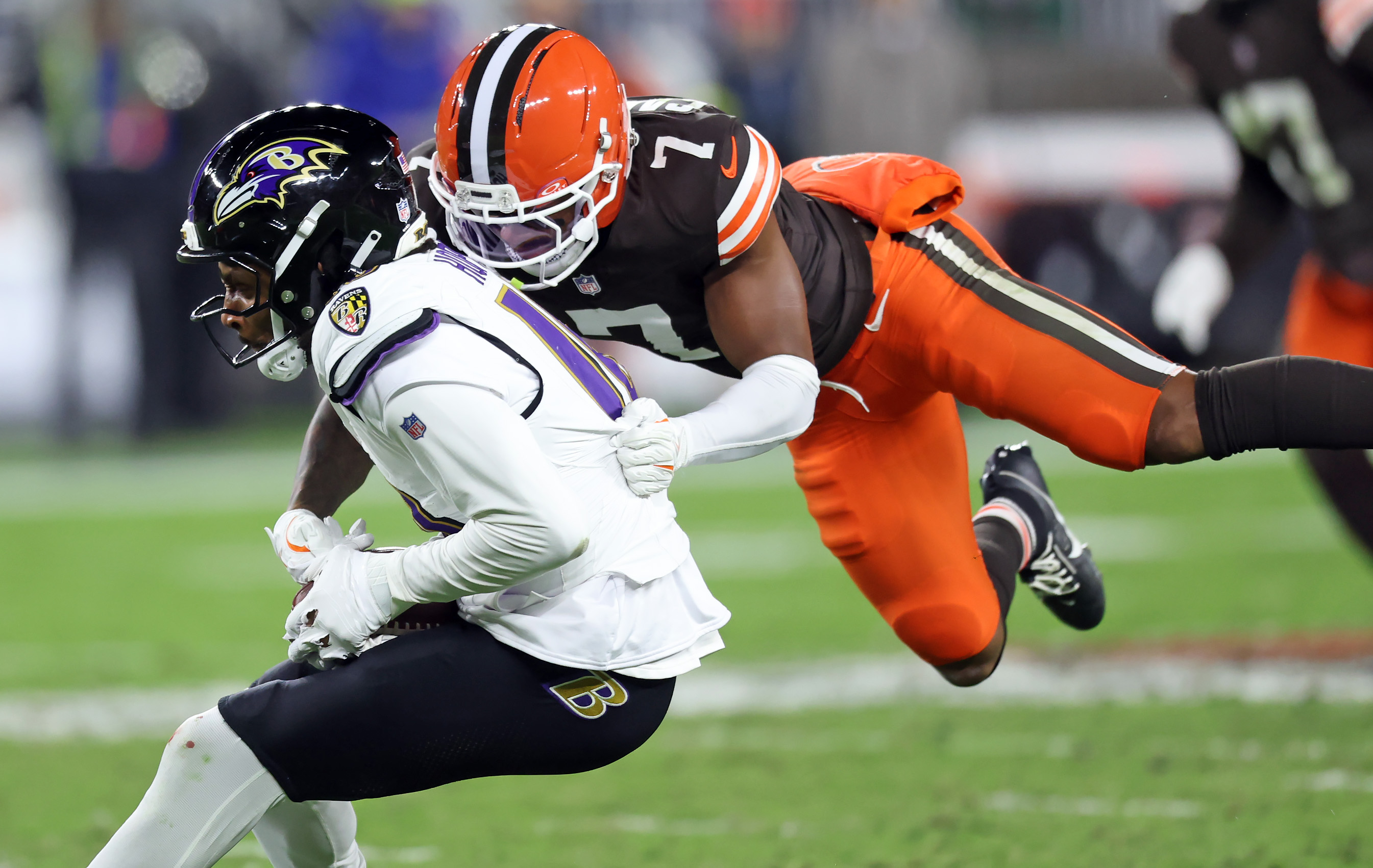 Cleveland Browns cornerback Tyson Campbell tackles Baltimore Ravens wide receiver DeAndre Hopkins in the second half of play. 