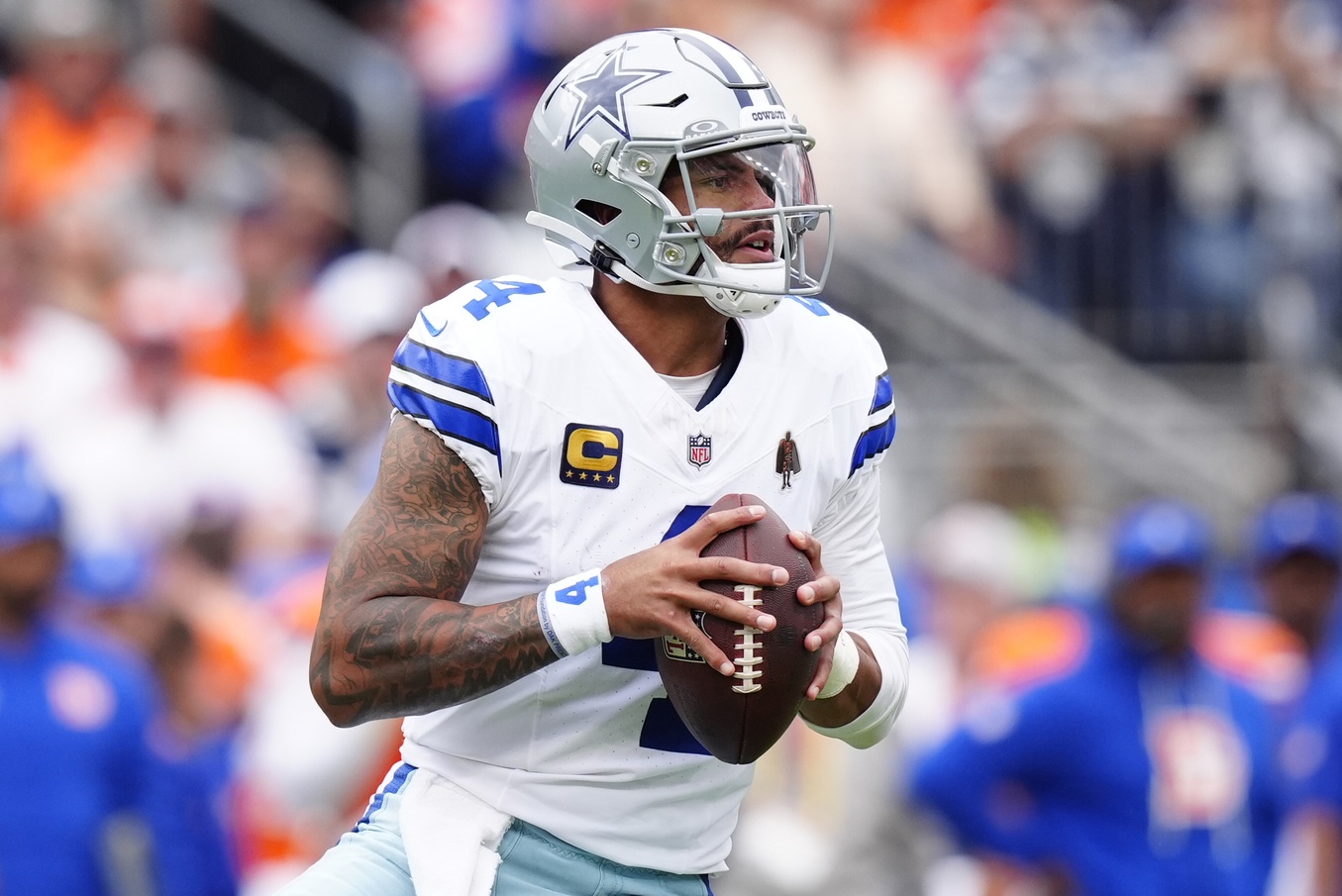 Cowboys star Dak Prescott looks to throw against the Broncos during the 2025 NFL season.