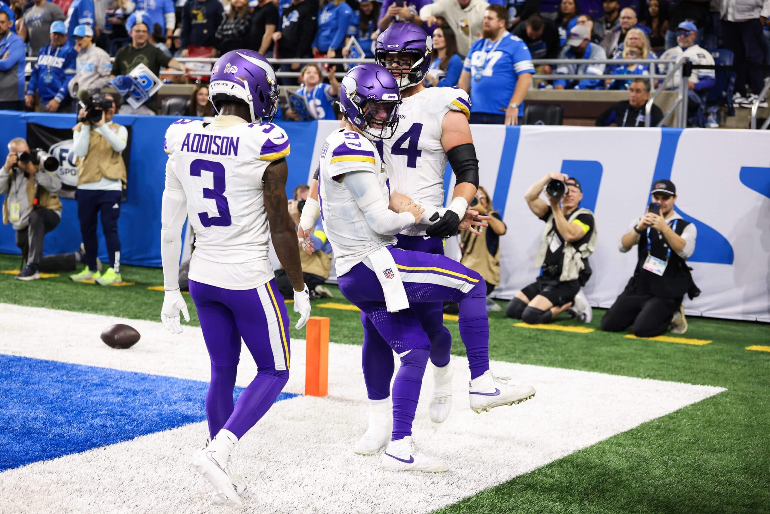 J.J. McCarthy celebrates after scoring a rushing touchdown for the Vikings.