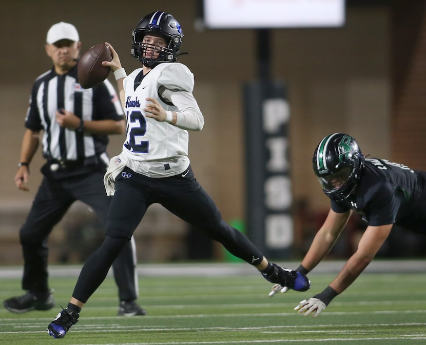 Hebron quarterback Brady Brock (12) gets off a pass despite the pursuit of Prosper defender...