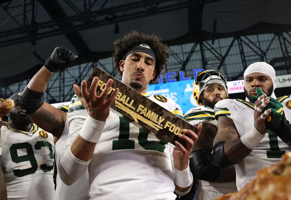 Nov 27, 2025; Detroit, Michigan, USA; Green Bay Packers quarterback Jordan Love (10) celebrates with the Madden MVP trophy after defeating the Detroit Lions at Ford Field. Mandatory Credit: David Reginek-Imagn Images