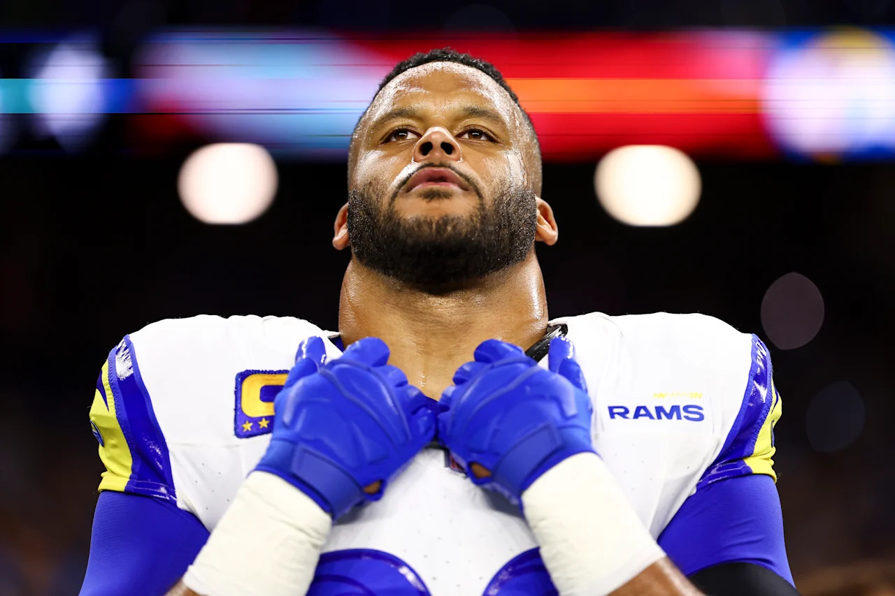 Rams DT Aaron Donald stands on the sidelines during the national anthem prior to an NFL wild-card playoff football game against the Detroit Lions. (Photo by Kevin Sabitus/Getty Images)