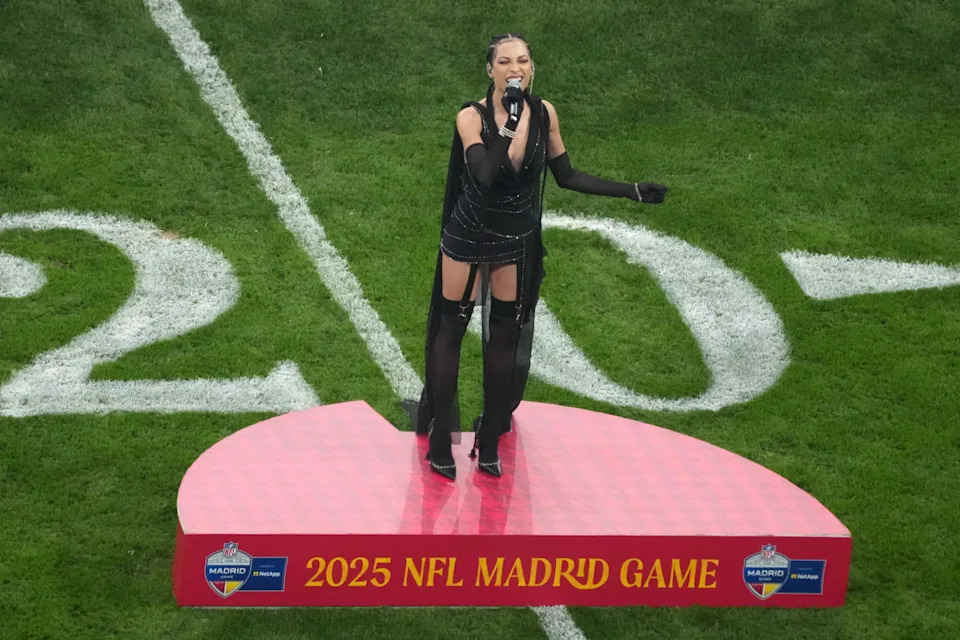 Nov 16, 2025; Madrid, Spain; Karina Pasian sings the United States national anthem during the 2025 NFL Madrid Game at Santiago Bernabeu Stadium. Mandatory Credit: Kirby Lee-Imagn Images© Kirby Lee-Imagn Images