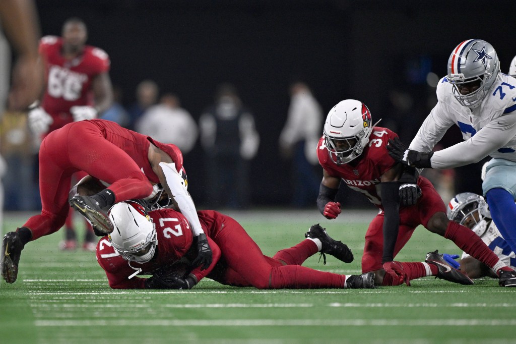 Arizona Cardinals linebacker Akeem Davis-Gaither (27) recovers a fumble by Dallas Cowboys running back Javonte Williams (33) in the second half.