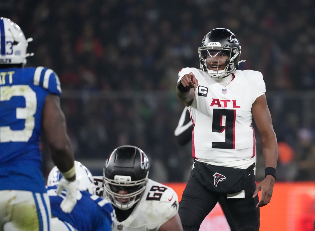 Atlanta Falcons quarterback Michael Penix Jr. (9) gestures before the snap.