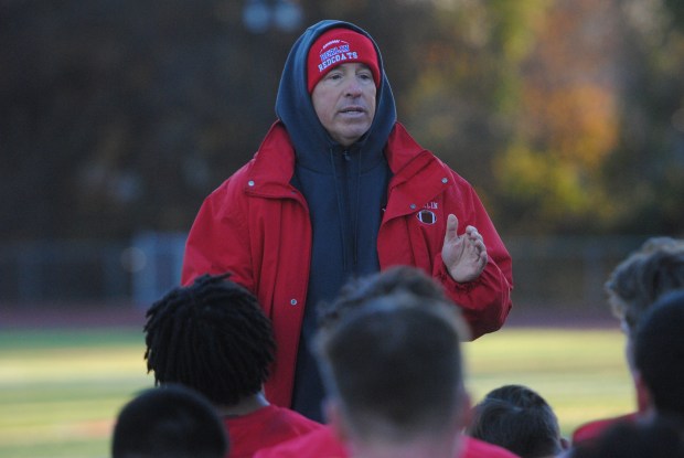 Berlin football coach John Capodice talks to his players last Monday at practice. (Photo by Lori Riley)