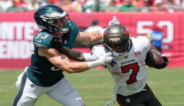 Tampa Bay Buccaneers running back Bucky Irving (7) is stopped by Philadelphia Eagles cornerback Cooper Dejean (33) during the first half of an NFL football game Sunday, Sept. 28, 2025, in Tampa, Fla. (AP Photo/Chris O'Meara)