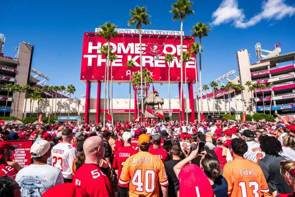 People waiting to get inside a football stadium