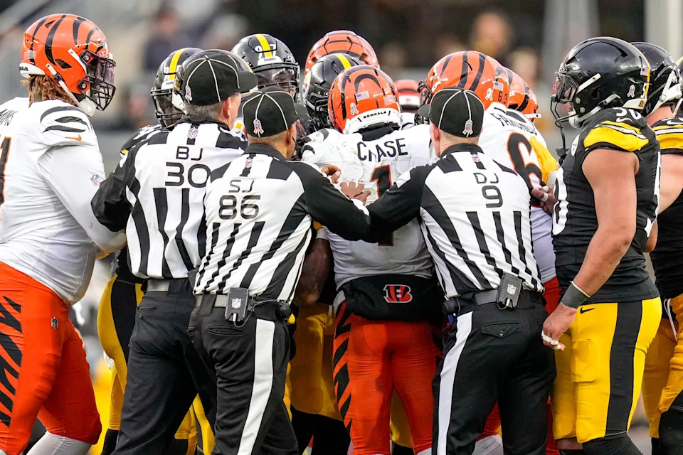 The Steelers' Jalen Ramsey fights with the Bengals' Ja'Marr Chase