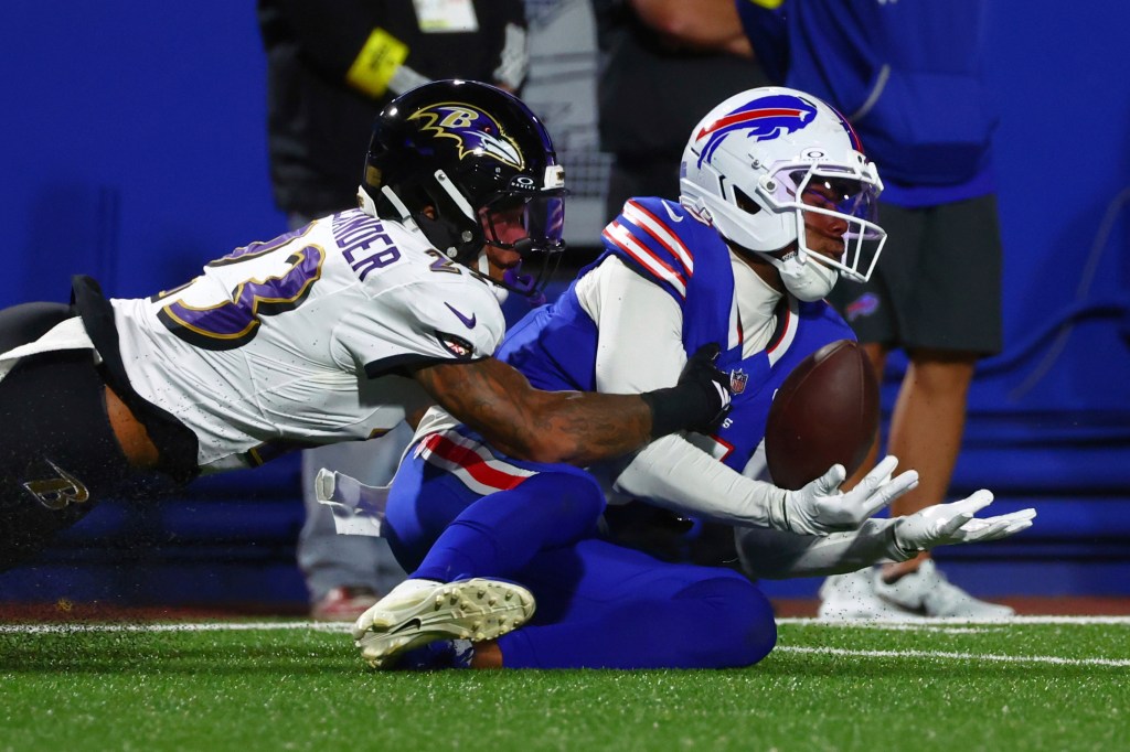 Baltimore Ravens cornerback Jaire Alexander (23) is called for interference as he breaks up a pass intended for Buffalo Bills wide receiver Joshua Palmer (5).