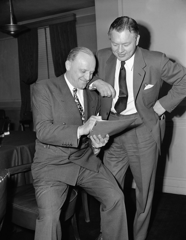 Chicago Bears owner George Halas, left, and Green Bay Packers coach Curly Lambeau on Jan. 23, 1947, at a meeting in Chicago. (Ed Maloney/AP)