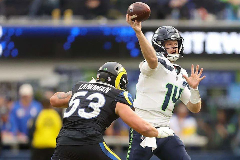 Seattle Seahawks quarterback Sam Darnold (14) passes the ball under pressure from Los Angeles Rams linebacker Nate Landman (53) during the second quarter at SoFi Stadium on November 16, 2025 in Inglewood, California. (Photo by Sean M. Haffey/Getty Images) Sean M. Haffey/Getty Images