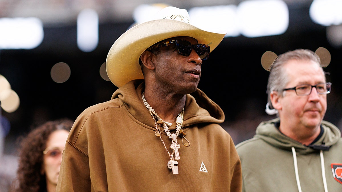 Deion Sanders walks on field