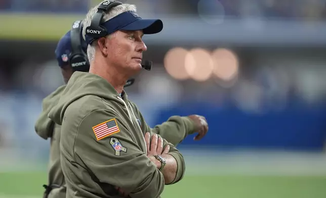 Tennessee Titans interim head coach Mike McCoy watches during the second half an NFL football game against the Indianapolis Colts, Sunday, Oct. 26, 2025, in Indianapolis. (AP Photo/Michael Conroy)