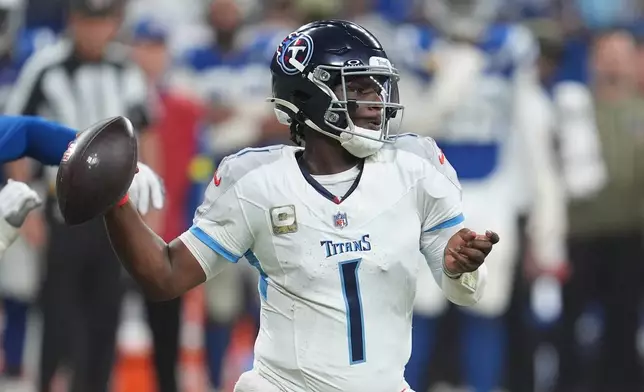 Tennessee Titans quarterback Cam Ward throws during the second half an NFL football game against the Indianapolis Colts, Sunday, Oct. 26, 2025, in Indianapolis. (AP Photo/Michael Conroy)