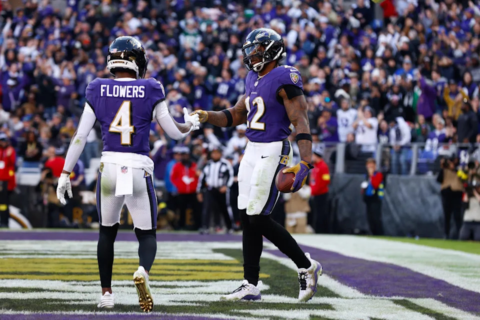 Nov 23, 2025; Baltimore, Maryland, USA; Baltimore Ravens running back Derrick Henry (22) celebrates with Baltimore Ravens wide receiver Zay Flowers (4) after scoring a touchdown during the third quarter against the New York Jets at M&T Bank Stadium. Mandatory Credit: Peter Casey-Imagn Images