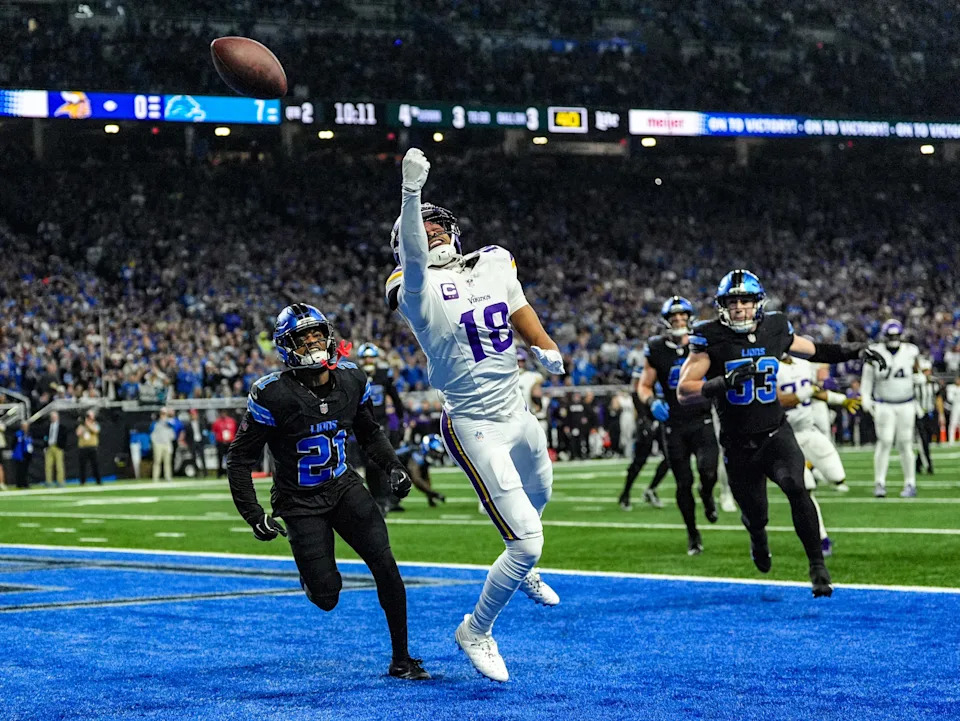 Minnesota Vikings wide receiver Justin Jefferson (18) misses the pass, while Detroit Lions cornerback Amik Robertson (21) covers him in the end zone, during the first half of the NFL game at Ford Field in Detroit on Sunday, Jan. 5, 2025.