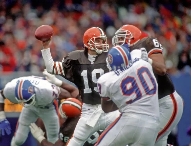 Quarterback Bernie Kosar throws against the Denver Broncos in a 1993 game.