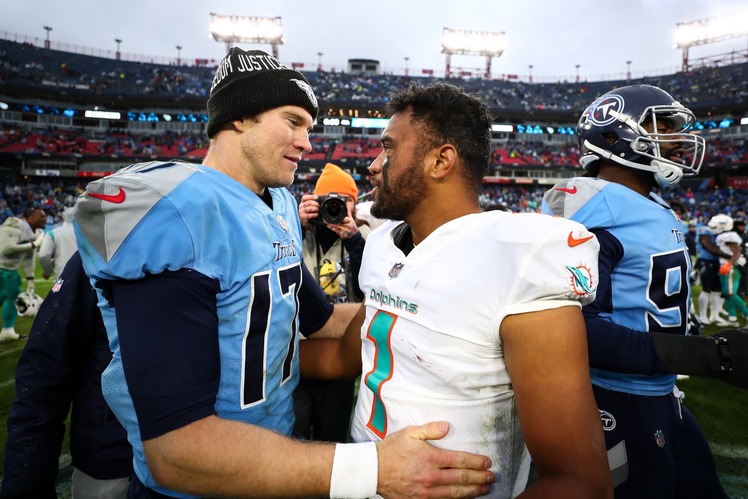 NASHVILLE, TN - JANUARY 2: Ryan Tannehill #17 of the Tennessee Titans hugs Tua Tagovailoa #1 of the Miami Dolphins after an NFL game at Nissan Stadium on January 2, 2022 in Nashville, Tennessee. (Photo by Kevin Sabitus/Getty Images)