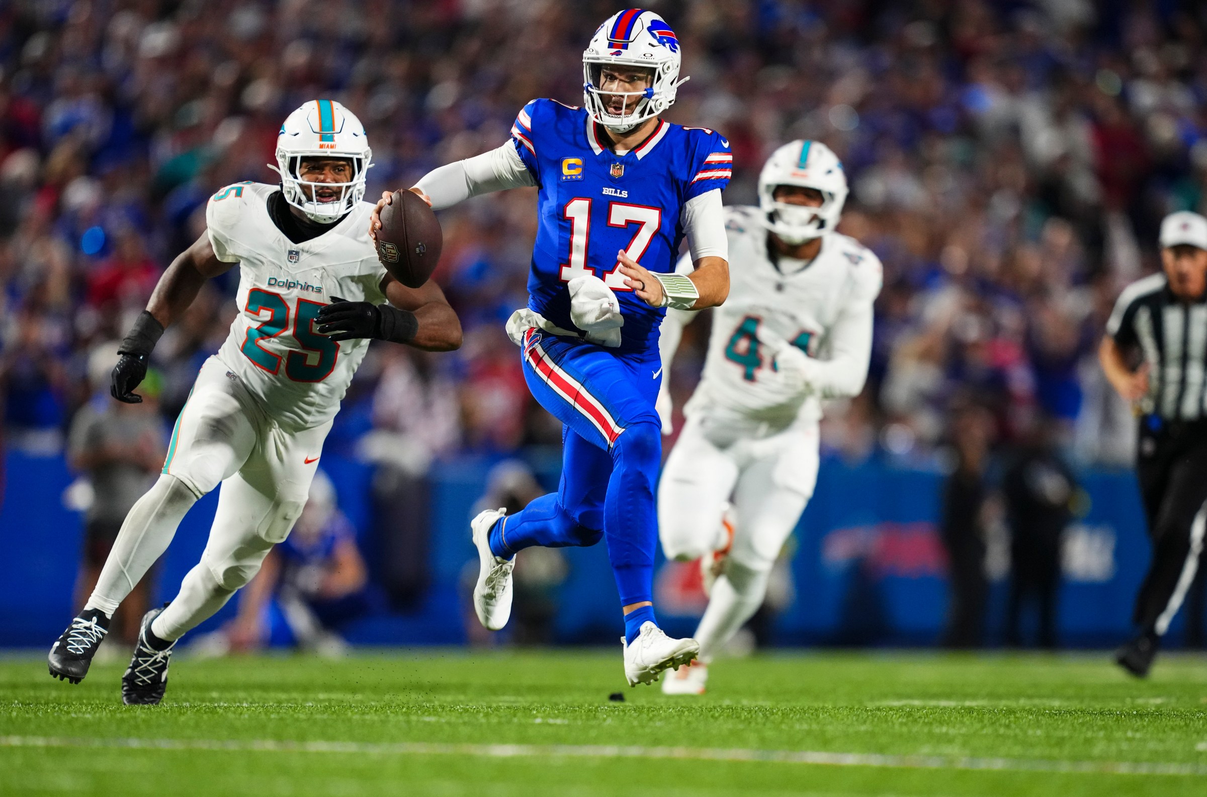 ORCHARD PARK, NY - SEPTEMBER 18: Josh Allen #17 of the Buffalo Bills scrambles out of the pocket during an NFL football game against the Miami Dolphins at Highmark Stadium on September 18, 2025 in Orchard Park, New York. (Photo by Cooper Neill/Getty Images)
