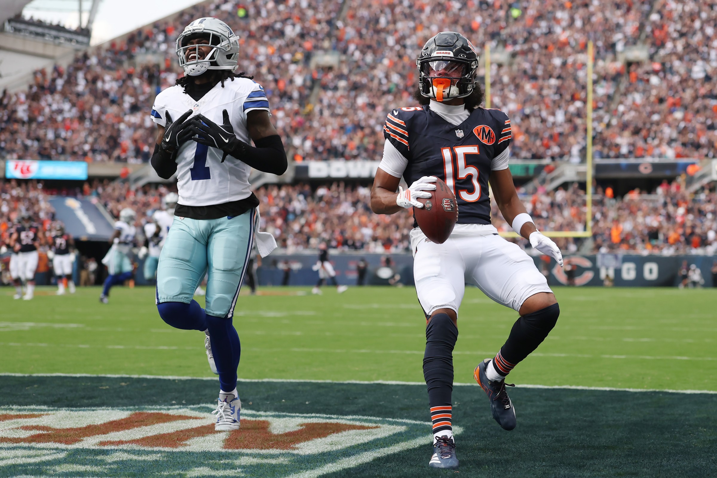 CHICAGO, ILLINOIS - SEPTEMBER 21: Rome Odunze #15 of the Chicago Bears scores a touchdown defended by Trevon Diggs #7 of the Dallas Cowboys during the first quarter at Soldier Field on September 21, 2025 in Chicago, Illinois. (Photo by Michael Reaves/Getty Images)