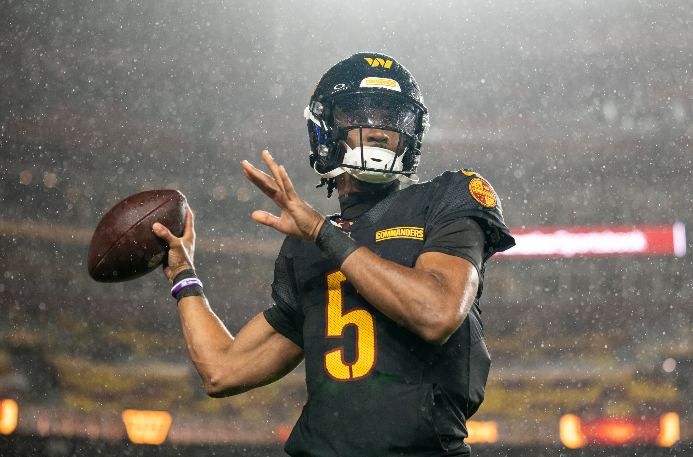 LANDOVER, MARYLAND - OCTOBER 13: Jayden Daniels #5 of the Washington Commanders looks to pass during an NFL football game against the Chicago Bears at Northwest Stadium on October 13, 2025 in Landover, Maryland. (Photo by Michael Owens/Getty Images)