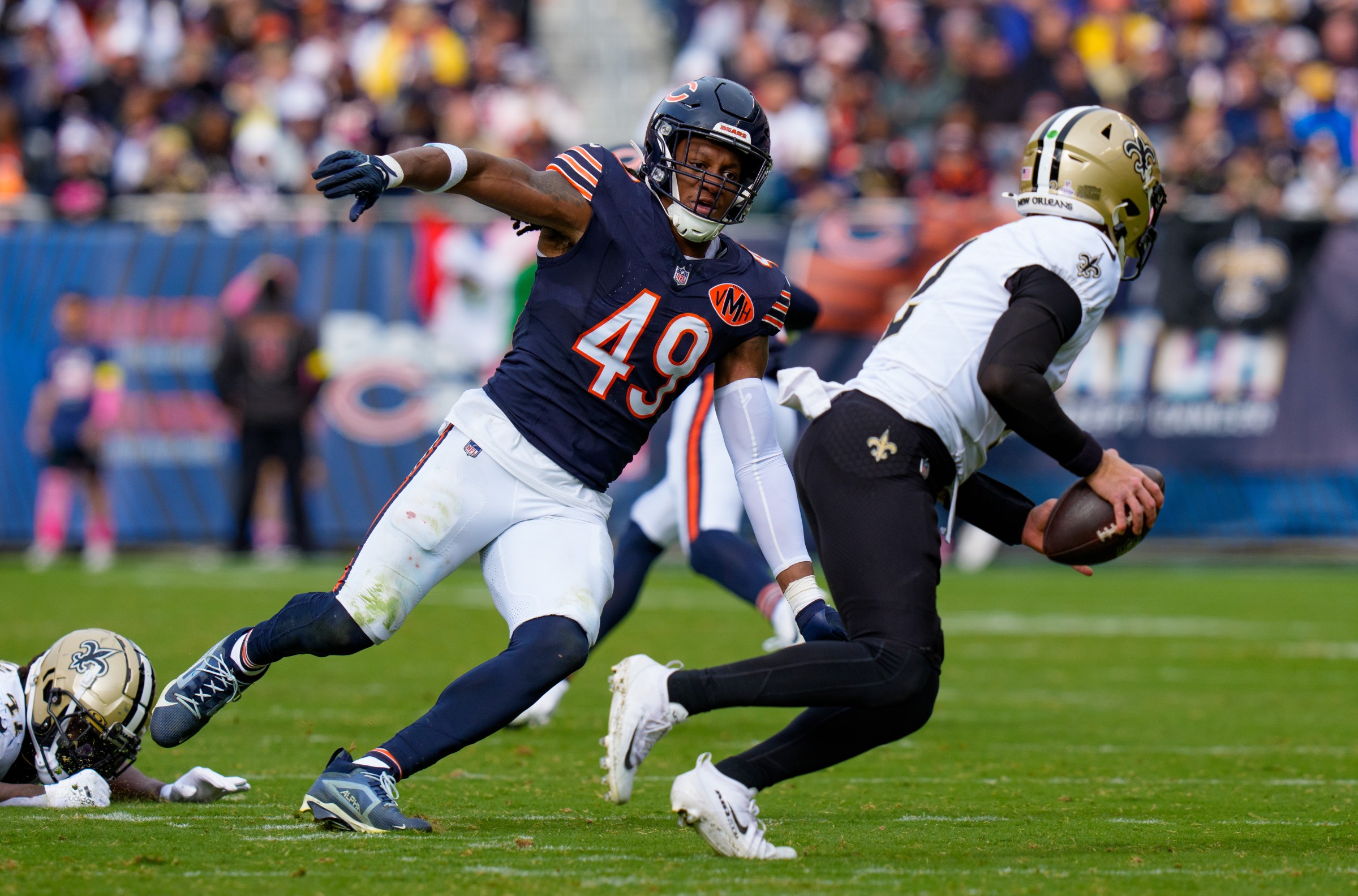 CHICAGO, ILLINOIS - OCTOBER 19: Tremaine Edmunds #49 of the Chicago Bears pursues Spencer Rattler #2 of the New Orleans Saints during the second half of the NFL football game at Solider Field on October 19, 2025 in Chicago, Illinois. (Photo by Todd Rosenberg/Getty Images)