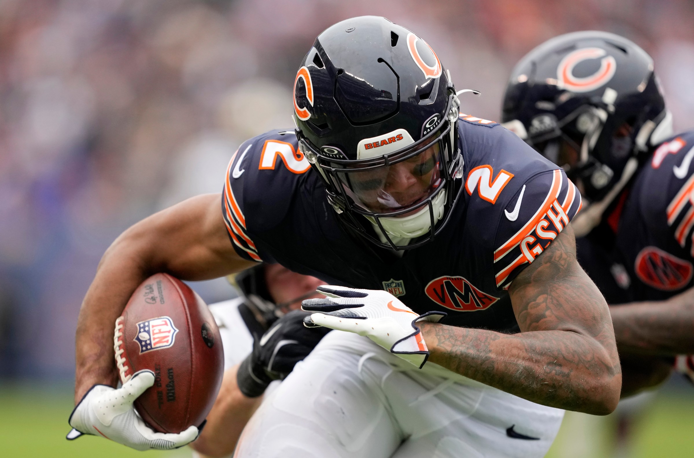 CHICAGO, ILLINOIS - OCTOBER 19: DJ Moore #2 of the Chicago Bears carries the ball after a reception against the New Orleans Saints during the first half of the game at Soldier Field on October 19, 2025 in Chicago, Illinois. (Photo by Patrick McDermott/Getty Images)