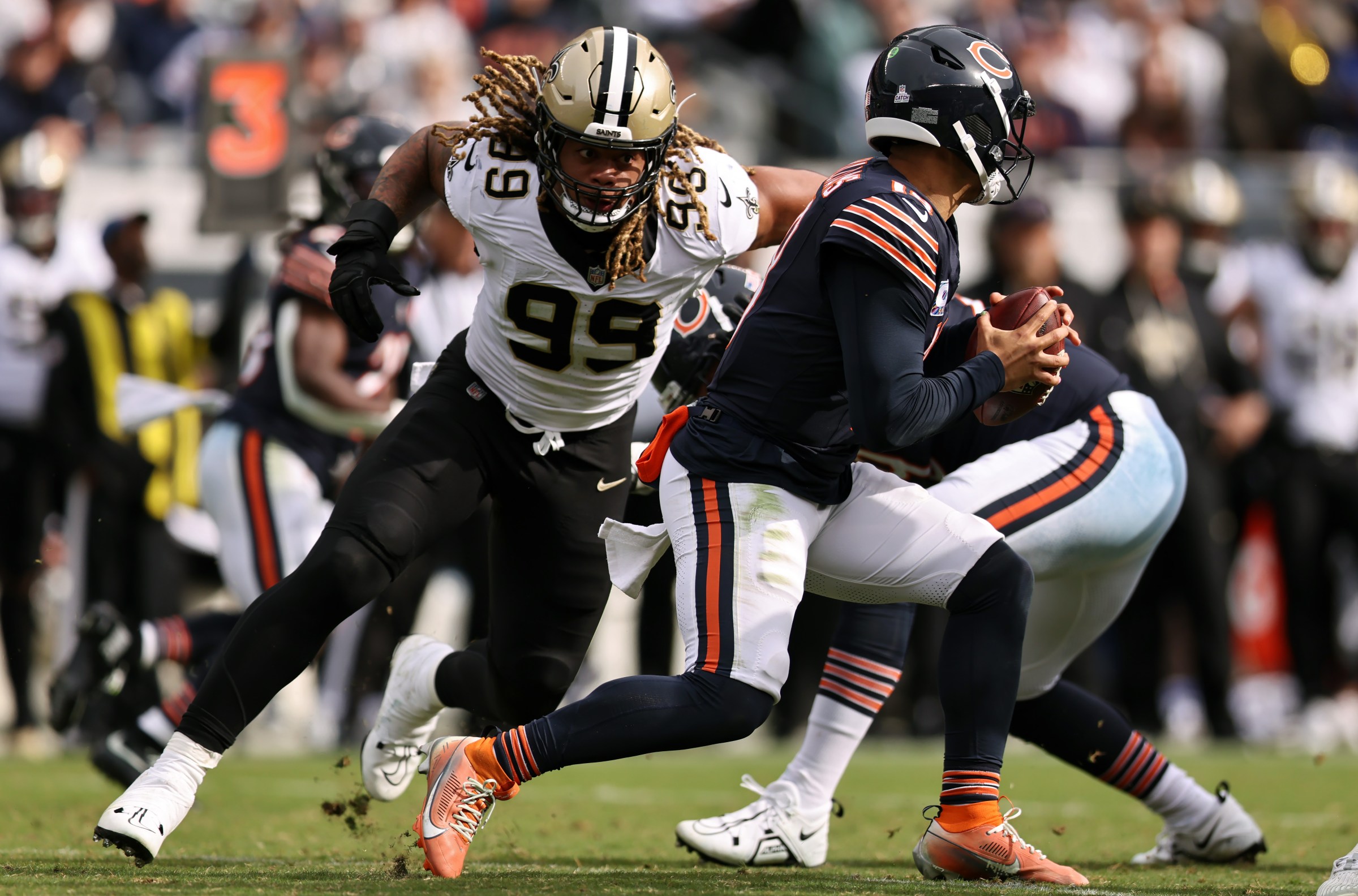 CHICAGO, ILLINOIS - OCTOBER 19: Chase Young #99 of the New Orleans Saints sacks Caleb Williams #18 of the Chicago Bears during the second half of the game at Soldier Field on October 19, 2025 in Chicago, Illinois. (Photo by Geoff Stellfox/Getty Images)