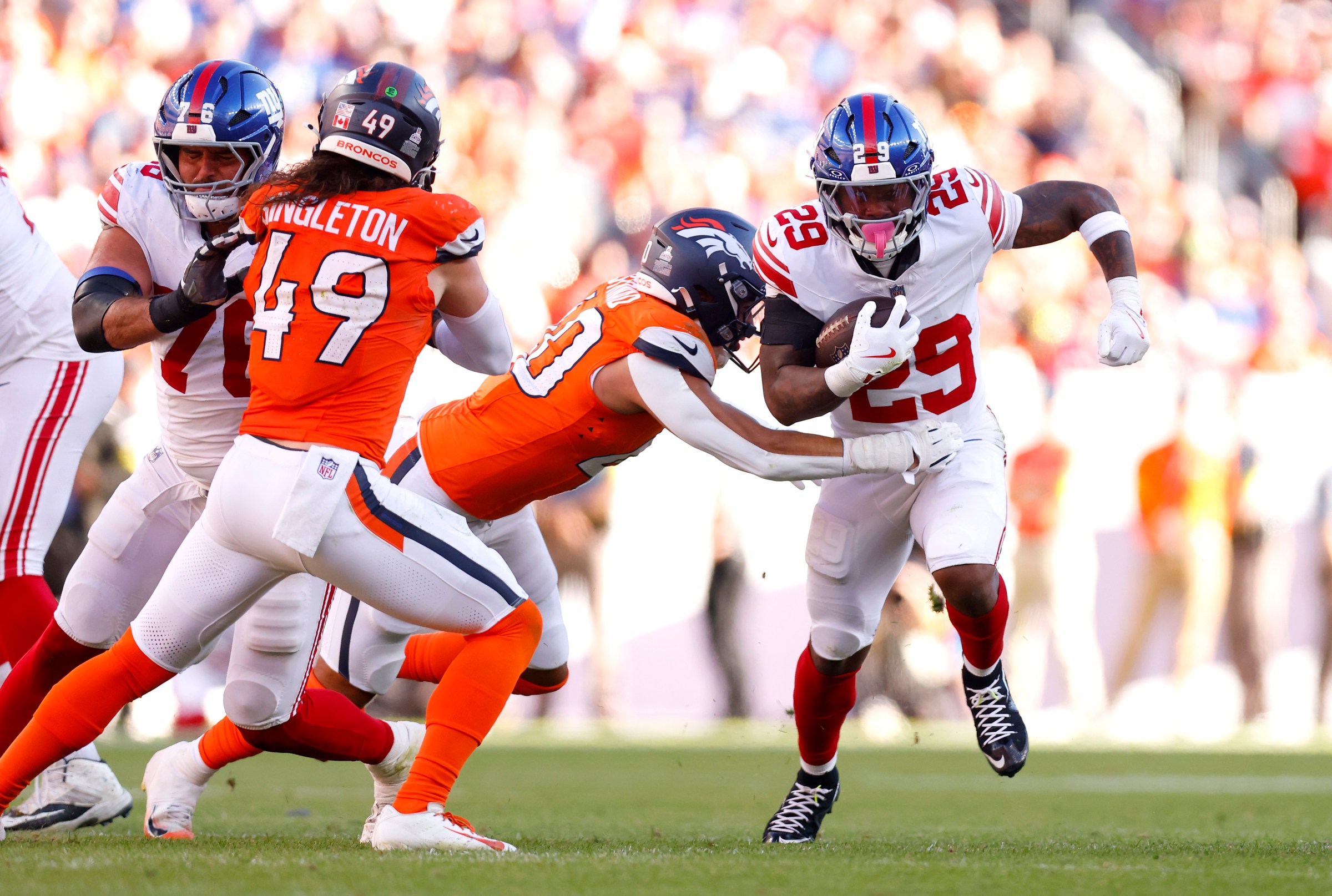 DENVER, COLORADO - OCTOBER 19: Tyrone Tracy Jr. #29 of the New York Giants scores a touchdown against the Denver Broncos at Empower Field At Mile High on October 19, 2025 in Denver, Colorado. (Photo by Justin Edmonds/Getty Images)