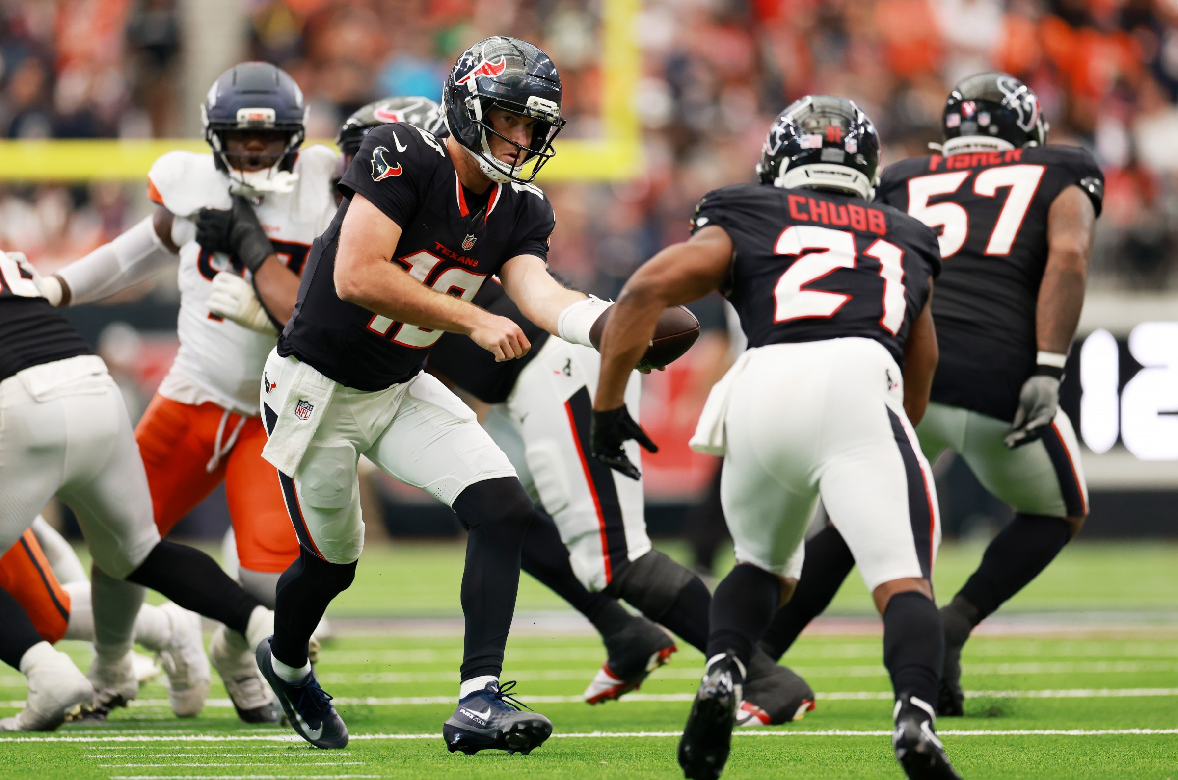 HOUSTON, TEXAS - NOVEMBER 02: Davis Mills #10 of the Houston Texans hands off to Nick Chubb #21 of the Houston Texans during the second half against the Denver Broncos in the game at NRG Stadium on November 02, 2025 in Houston, Texas. (Photo by Kenneth Richmond/Getty Images)