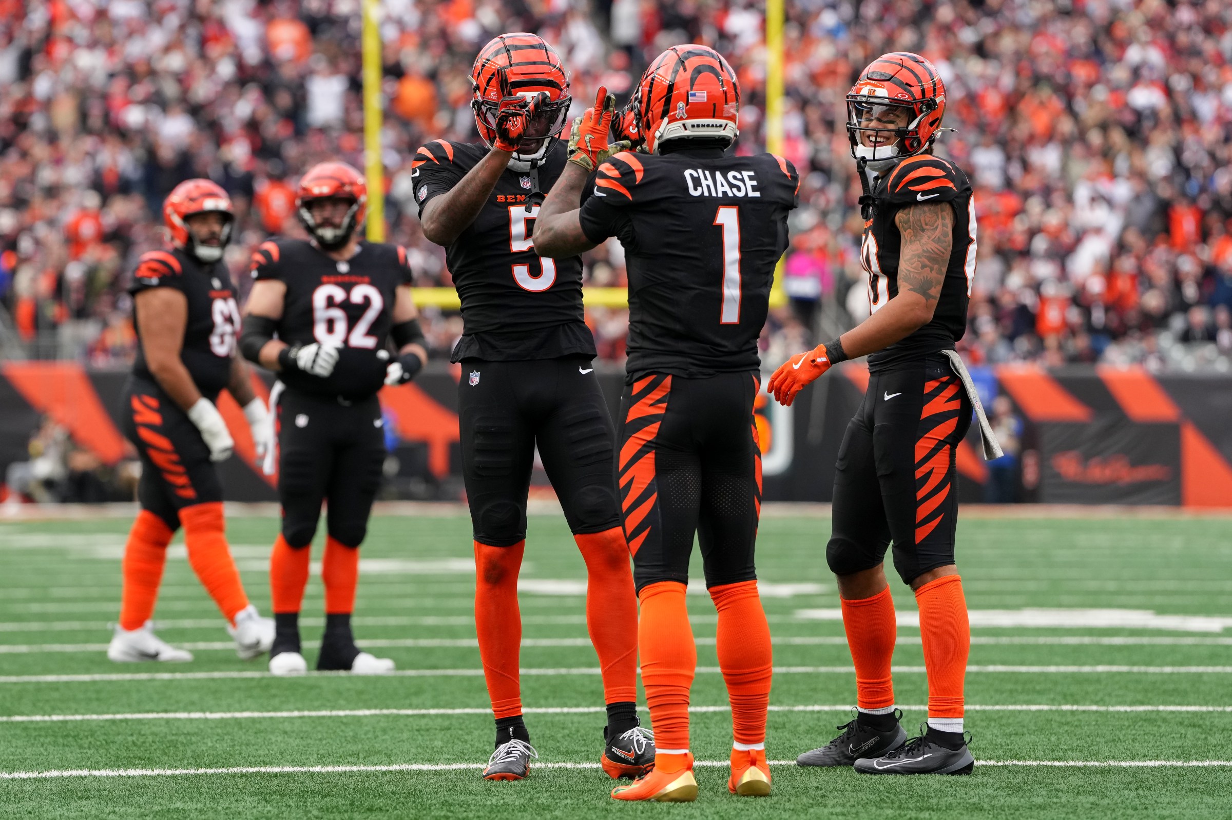 CINCINNATI, OHIO - NOVEMBER 02: Tee Higgins #5 and Ja’Marr Chase #1 of the Cincinnati Bengals celebrate after Higgins scored a touchdown during the third quarter against the Chicago Bears in the game at Paycor Stadium on November 02, 2025 in Cincinnati, Ohio. (Photo by Dylan Buell/Getty Images)