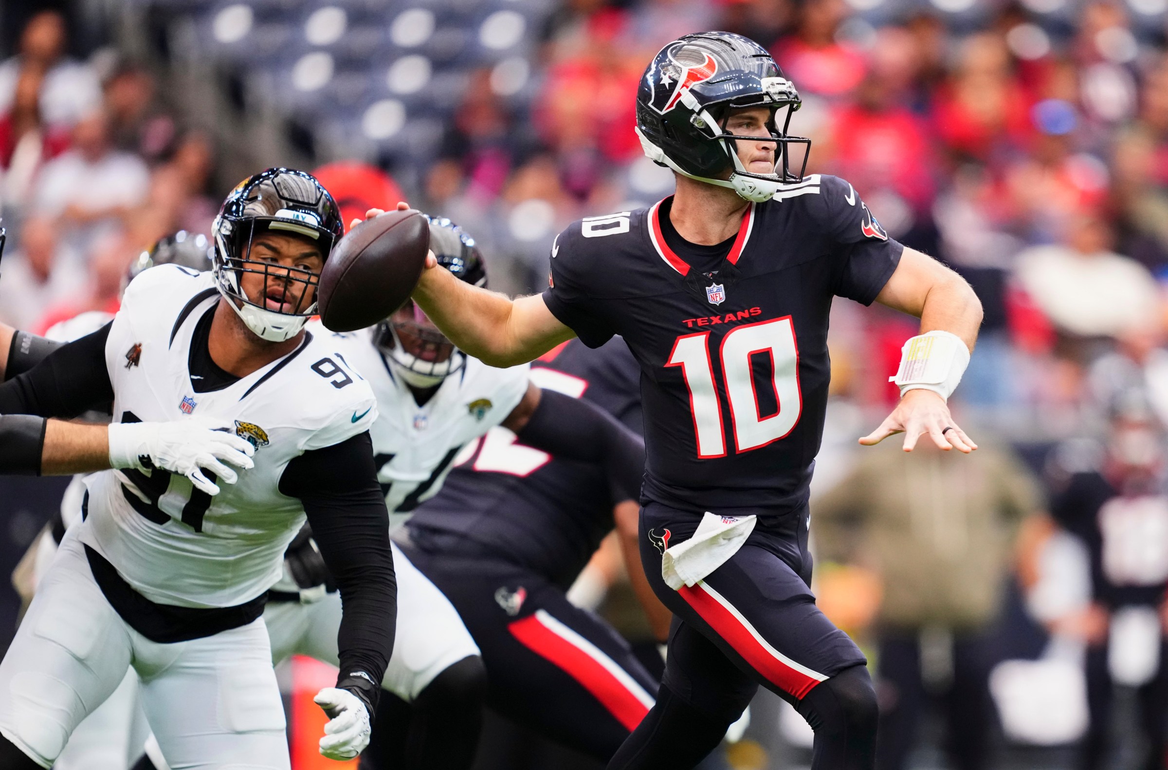 HOUSTON, TX - NOVEMBER 09: Davis Mills #10 of the Houston Texans drops back to pass against the Jacksonville Jaguars during the first half of an NFL football game at NRG Stadium on November 9, 2025 in Houston, Texas. (Photo by Cooper Neill/Getty Images)