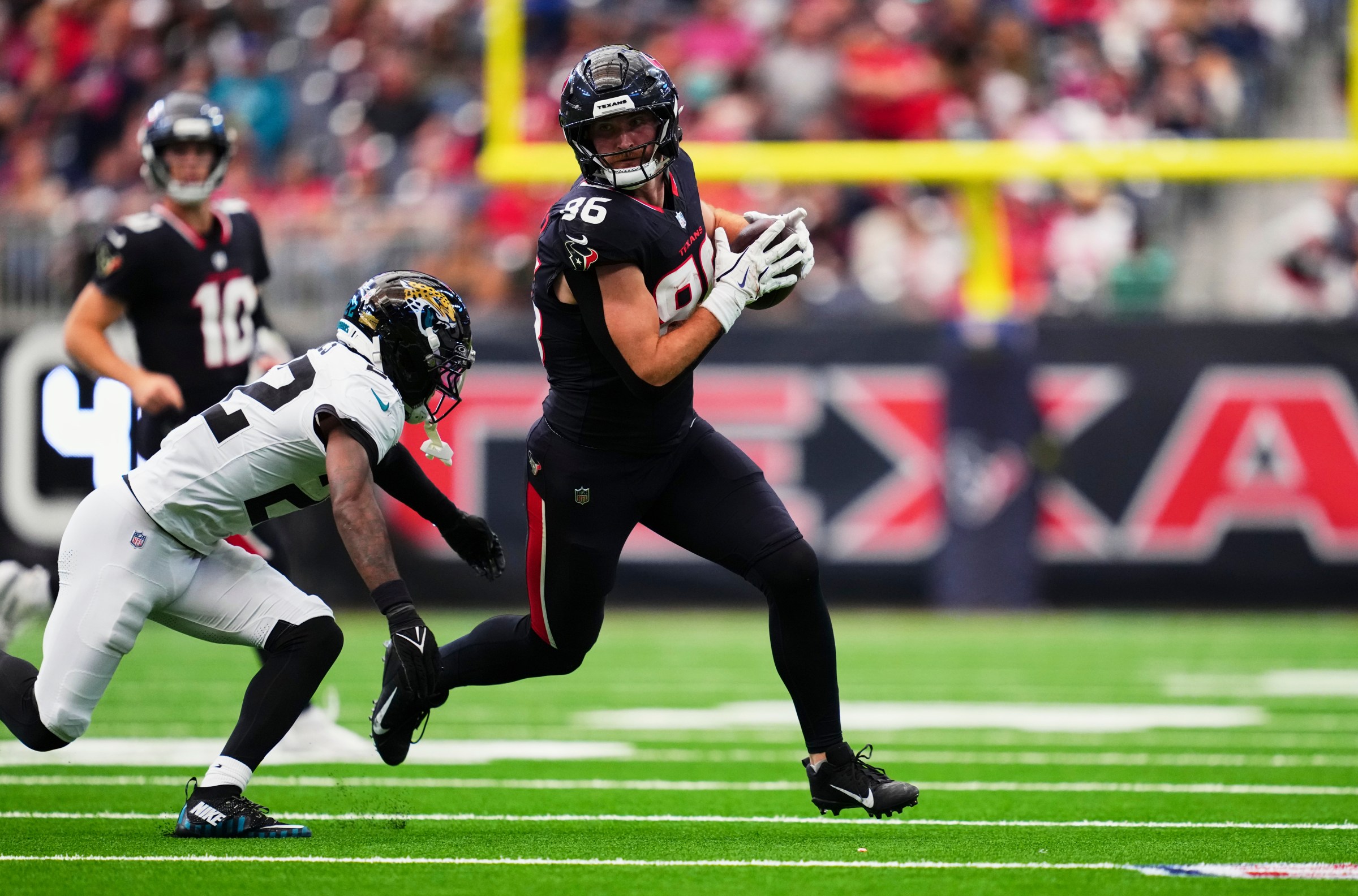 HOUSTON, TX - NOVEMBER 09: Dalton Schultz #86 of the Houston Texans runs with the ball against the Jacksonville Jaguars during the second half of an NFL football game at NRG Stadium on November 9, 2025 in Houston, Texas. (Photo by Cooper Neill/Getty Images)
