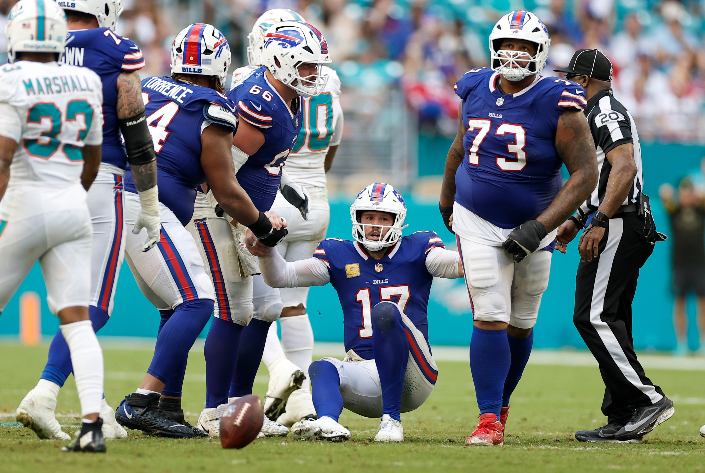 MIAMI GARDENS, FL - NOVEMBER 09: Buffalo Bills quarterback Josh Allen (17) is helped up by teammates after a hit during the game between the Miami Dolphins and the Buffalo Bills on November 9, 2025 at Hard Rock Stadium in Miami Gardens, Fl. (Photo by David Rosenblum/Icon Sportswire via Getty Images)