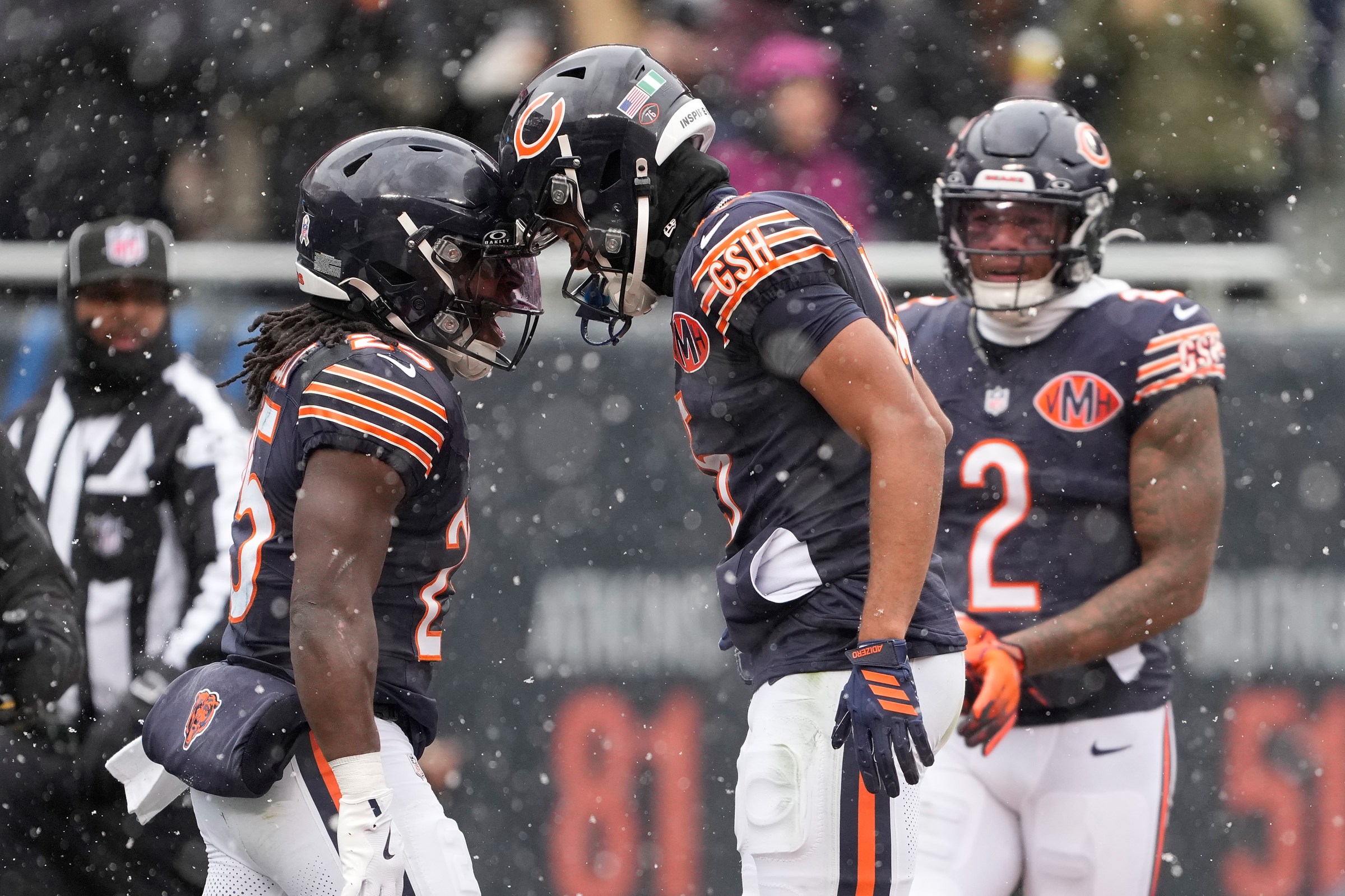 CHICAGO, ILLINOIS - NOVEMBER 09: Kyle Monangai #25 and Rome Odunze #15 of the Chicago Bears celebrate after a touchdown against the New York Giants during the first quarter in the game at Soldier Field on November 09, 2025 in Chicago, Illinois. (Photo by Patrick McDermott/Getty Images)