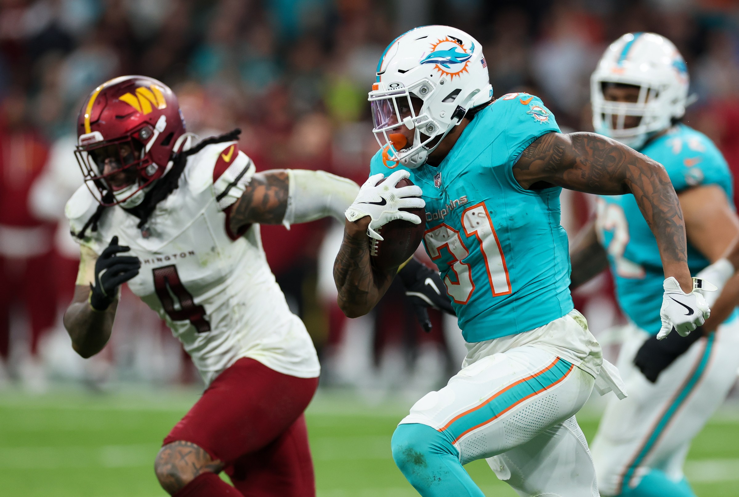MADRID, SPAIN - NOVEMBER 16: Ollie Gordon II of Miami Dolphins (#31) runs with ball during the NFL 2025 game between Washington Commanders and Miami Dolphins at Estadio Santiago Bernabeu on November 16, 2025 in Madrid, Spain. (Photo by Florencia Tan Jun/Getty Images)
