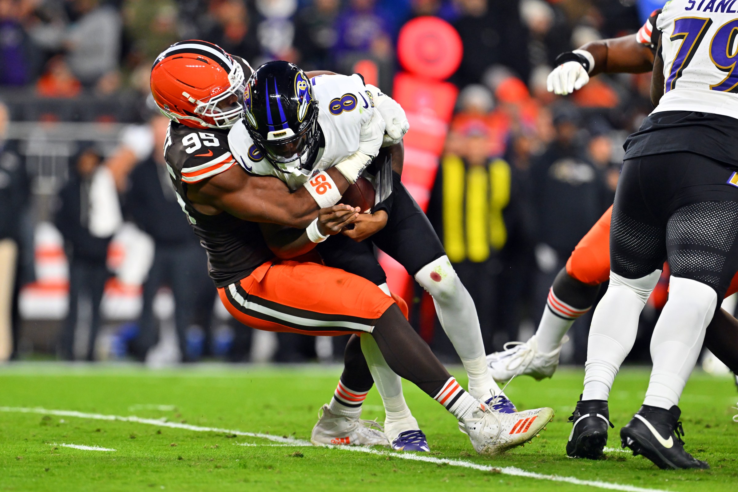 CLEVELAND, OHIO - NOVEMBER 16: Myles Garrett #95 of the Cleveland Browns sacks Lamar Jackson #8 of the Baltimore Ravens during the second quarter at Huntington Bank Field on November 16, 2025 in Cleveland, Ohio. (Photo by Jason Miller/Getty Images)