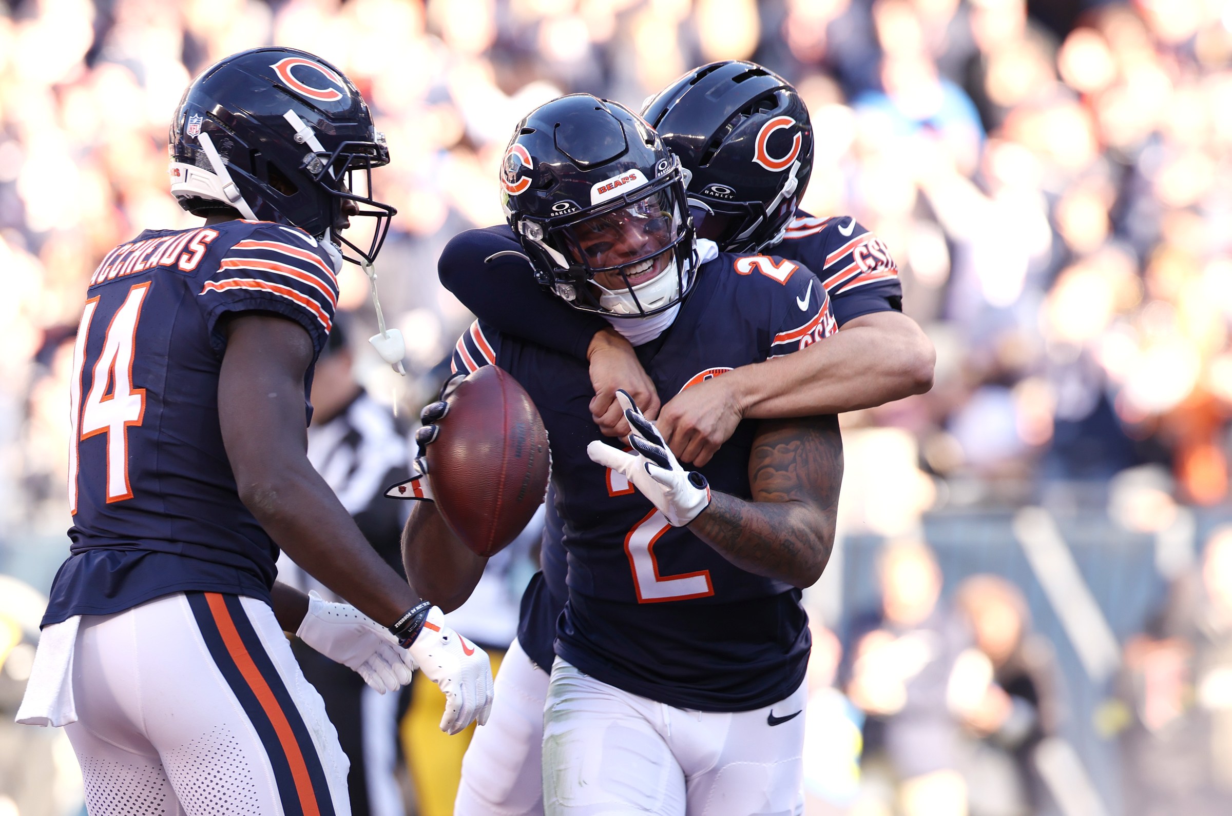 CHICAGO, ILLINOIS - NOVEMBER 23: DJ Moore #2 and Caleb Williams #18 of the Chicago Bears celebrate a first quarter touchdown against the Pittsburgh Steelers at Soldier Field on November 23, 2025 in Chicago, Illinois. (Photo by Geoff Stellfox/Getty Images)