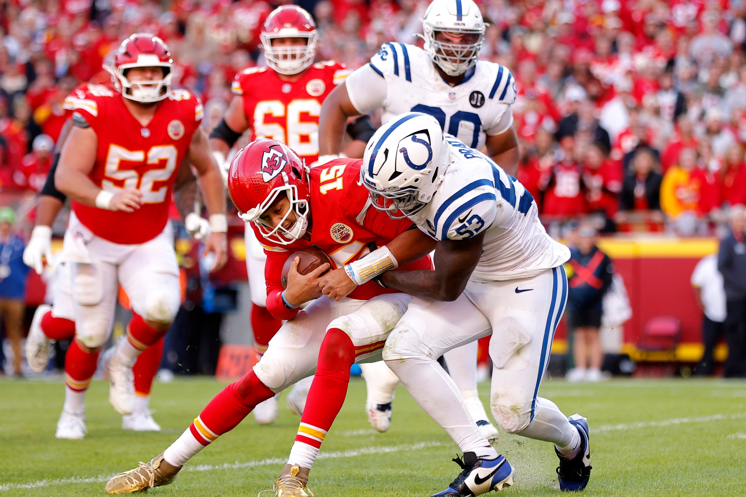 Germaine Pratt (53) of the Indianapolis Colts tackles Patrick Mahomes (15) of the Kansas City Chiefs in Sunday’s fourth quarter.(Photo by David Eulitt/Getty Images)