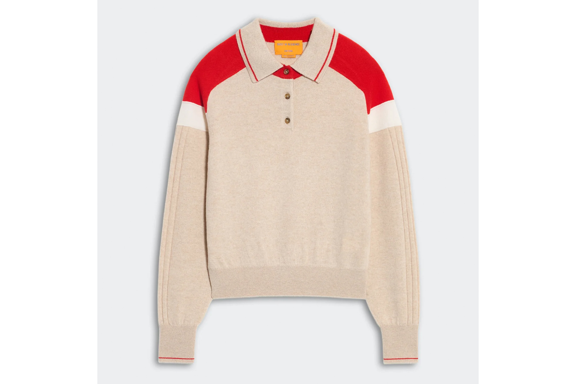 Cream-colored polo sweater with red shoulders and white stripes on the sleeves.