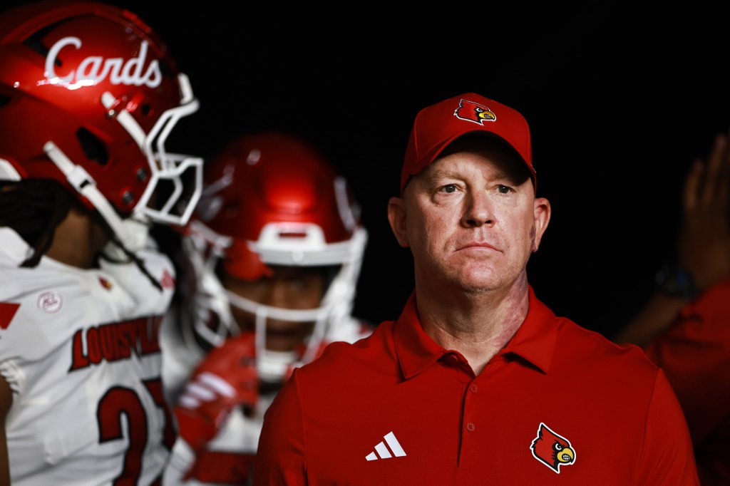 Louisville Cardinals head coach Jeff Brohm watches his team on the sideline.