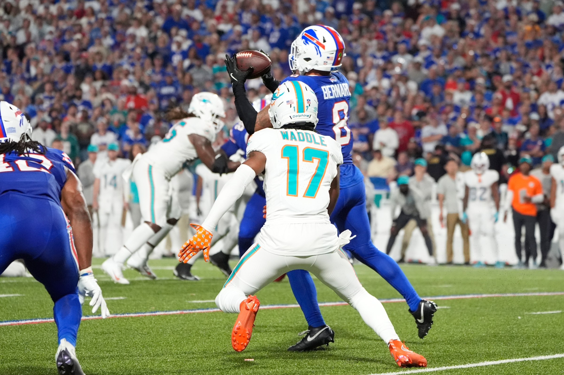 Sep 18, 2025; Orchard Park, New York, USA; Buffalo Bills linebacker Terrel Bernard (8) intercepts the ball against Miami Dolphins wide receiver Jaylen Waddle (17) in the fourth quarter at Highmark Stadium. Mandatory Credit: Gregory Fisher-Imagn Images