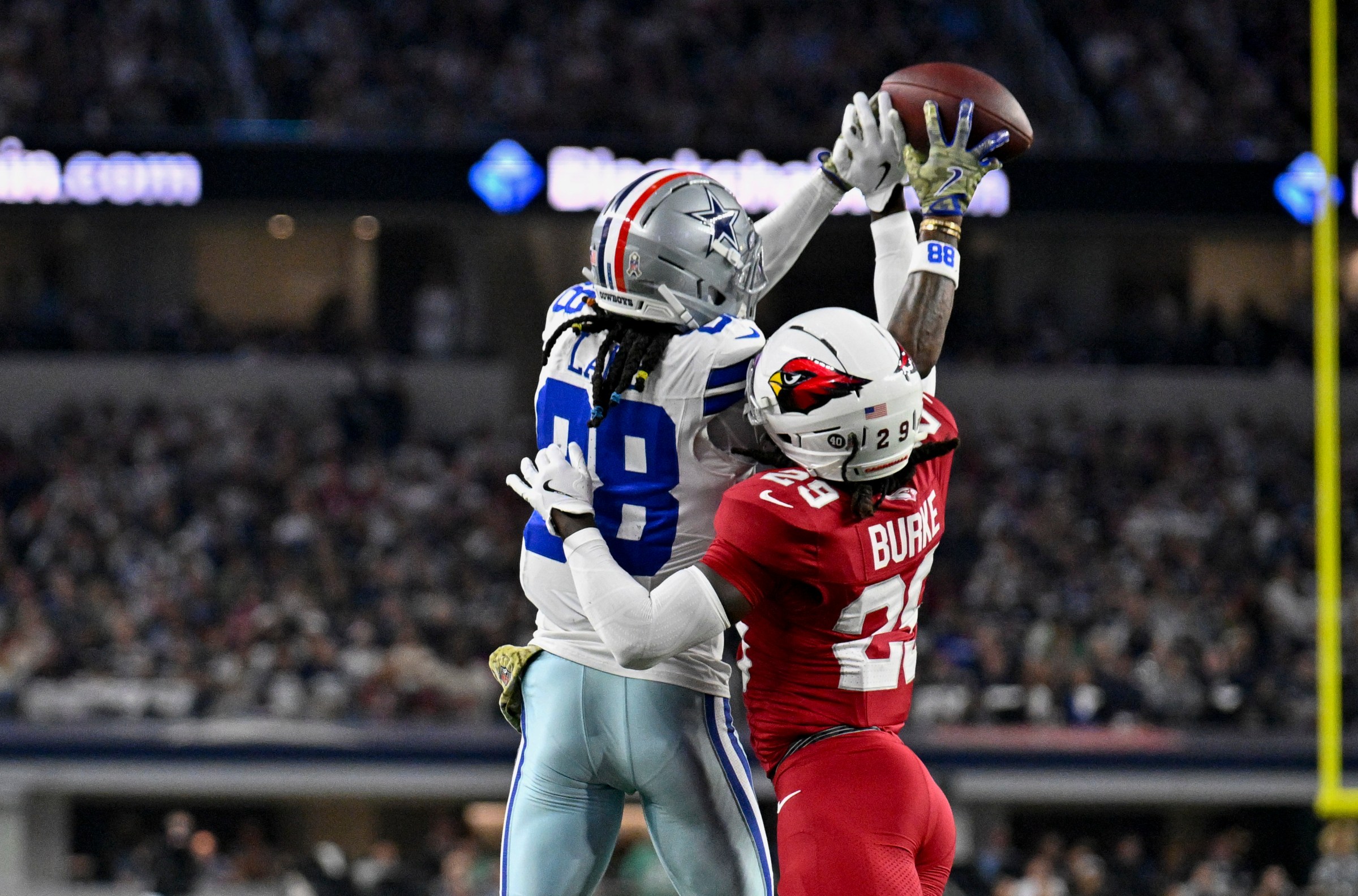 Nov 3, 2025; Arlington, Texas, USA; Arizona Cardinals cornerback Denzel Burke (29) breaks up a pass intended for Dallas Cowboys wide receiver CeeDee Lamb (88) during the game between the Dallas Cowboys and the Arizona Cardinals at AT&T Stadium. Mandatory Credit: Jerome Miron-Imagn Images