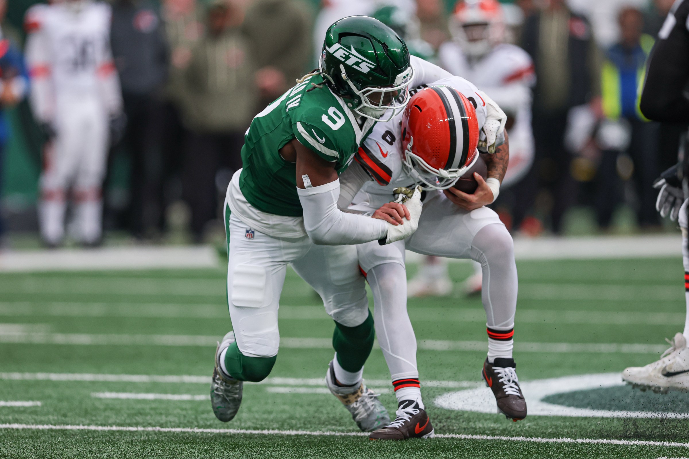 Nov 9, 2025; East Rutherford, New Jersey, USA; New York Jets safety Andre Cisco (8) is sacked by New York Jets defensive end Will McDonald IV (9) during the first half at MetLife Stadium. Mandatory Credit: Vincent Carchietta-Imagn Images