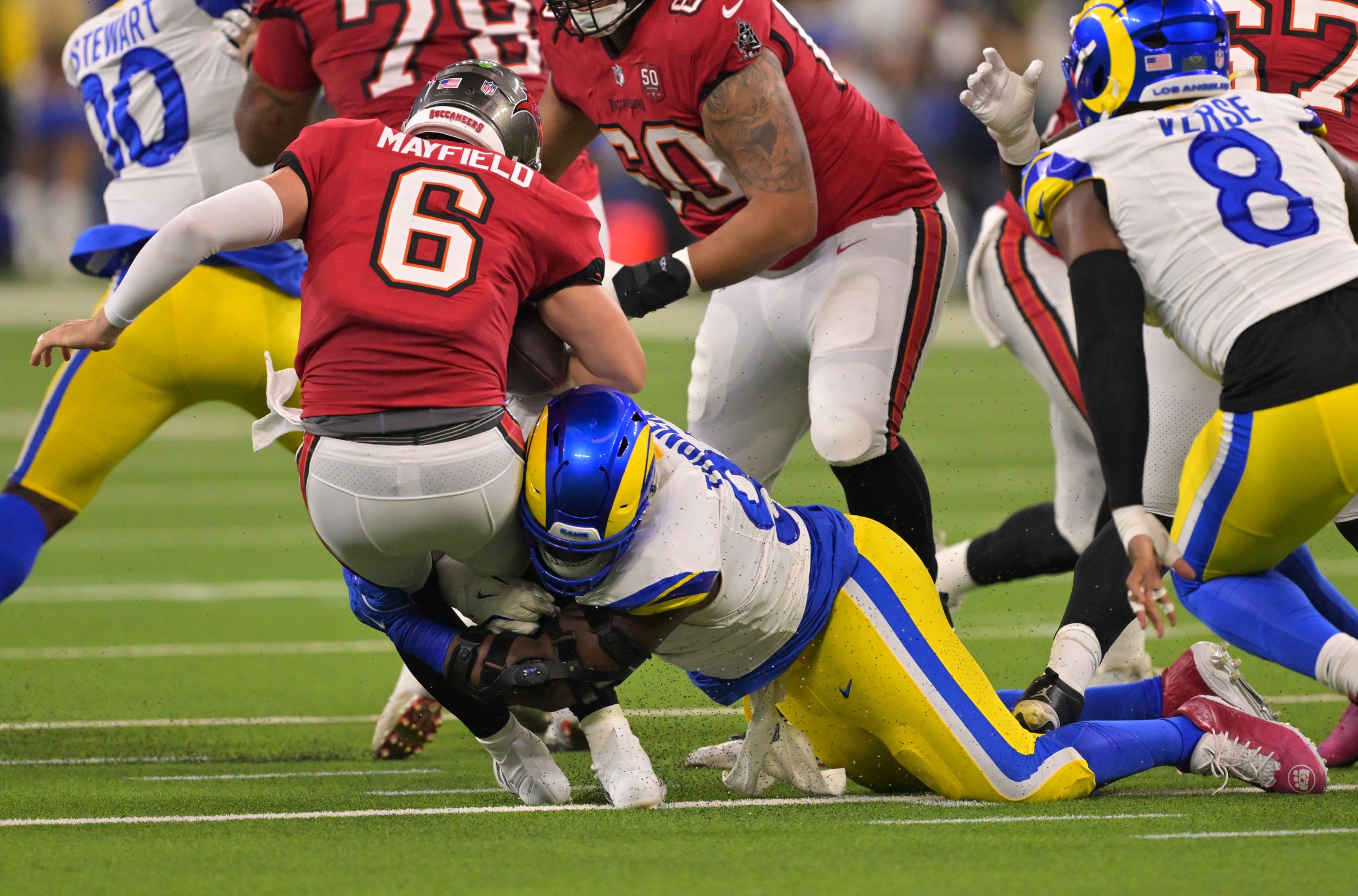 Nov 23, 2025; Inglewood, California, USA; Tampa Bay Buccaneers quarterback Baker Mayfield (6) is sacked by Los Angeles Rams linebacker Byron Young (0) in the first half at SoFi Stadium. Mandatory Credit: Jayne Kamin-Oncea-Imagn Images