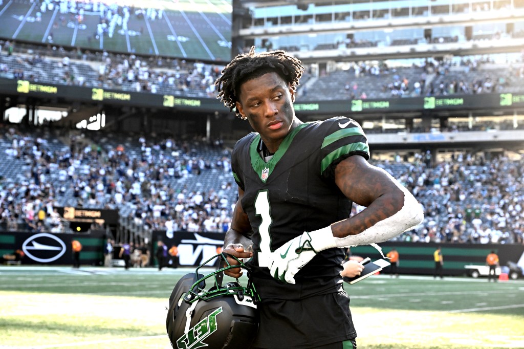 Jets cornerback Sauce Gardner (1) walks off the field after the Dallas Cowboys 37-22 win over the Jets.