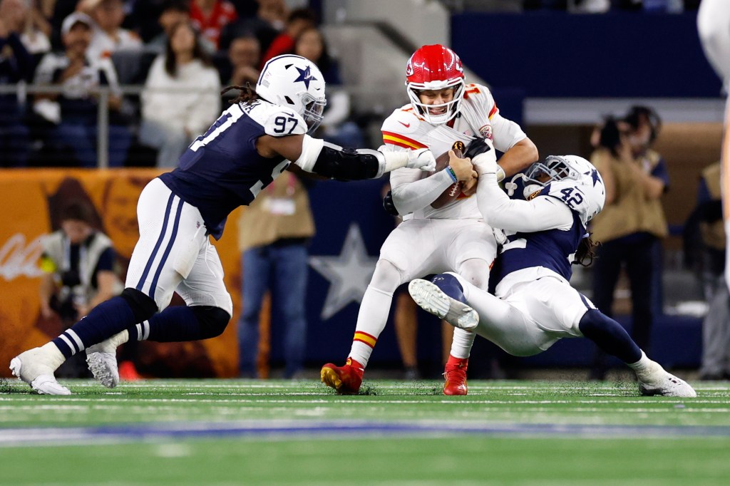 Kansas City Chiefs quarterback Patrick Mahomes sacked by Dallas Cowboys defensive end Jadeveon Clowney (42) and defensive tackle Osa Odighizuwa (97).