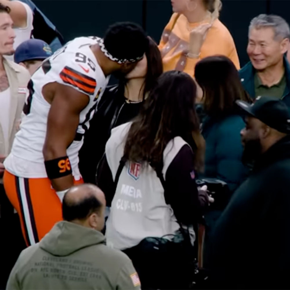 Browns defensive end Myles Garrett and Olympic snowboarder Chloe Kim on the sideline before Cleveland's game against the Raiders at Allegiant Stadium on November 23, 2025. 